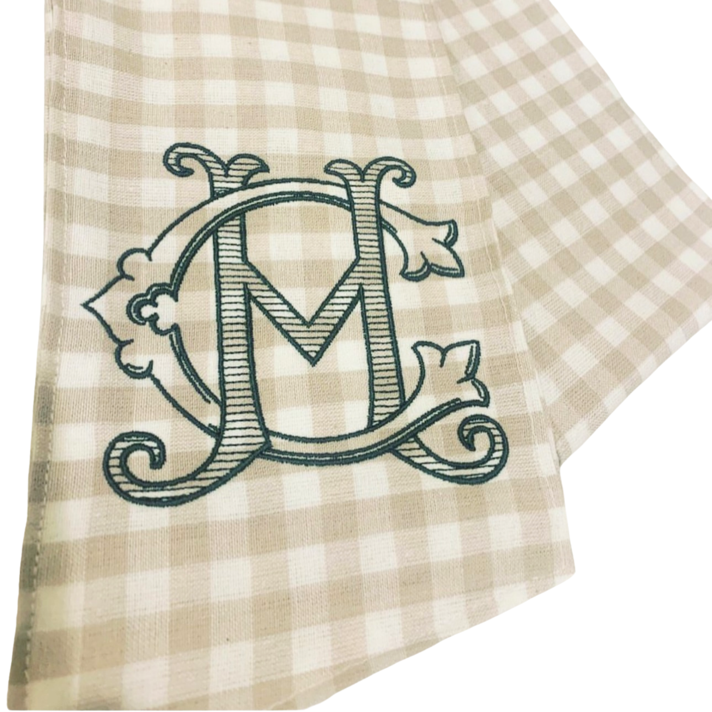 Beige checkered fabric with a decorative letter monogram on a white background