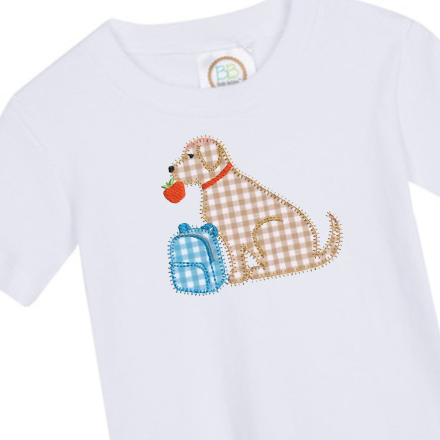 White baby onesie with a plaid dog design holding a blue bag and an apple.