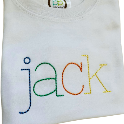White baby romper with colorful embroidered name 'jack' on a white background