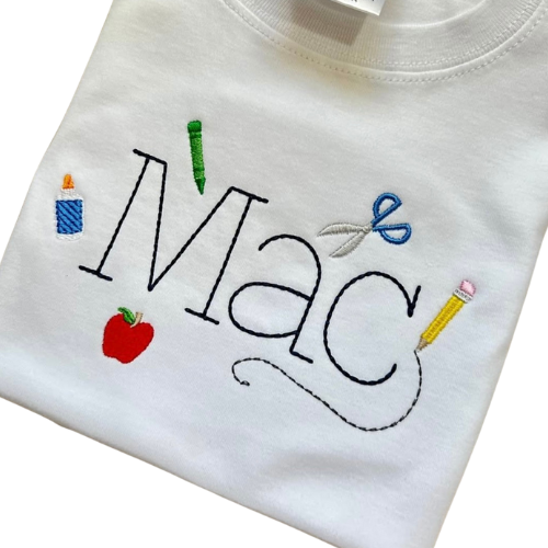 White shirt with embroidered name 'Mac' and educational-themed decorations on a white background