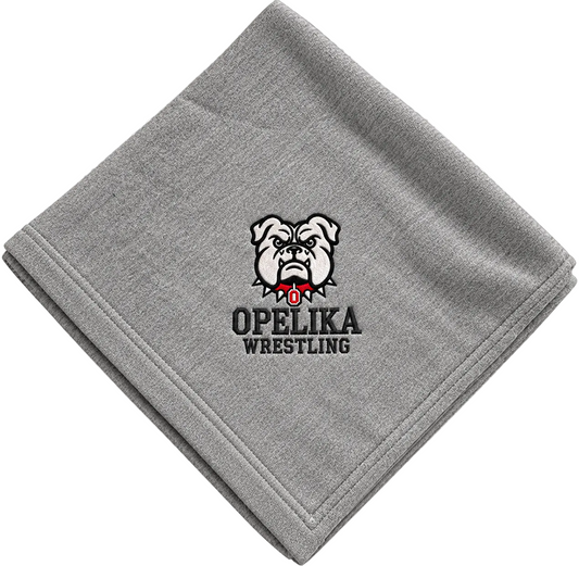 A folded gray t-shirt towel featuring the 'OPELIKA WRESTLING' bulldog logo in black, white, and red, shown on a transparent checkerboard background.