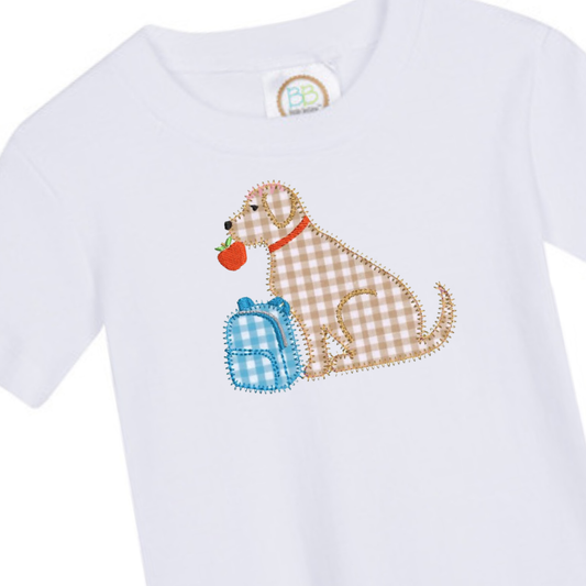 White baby onesie with a plaid dog design holding a blue bag and an apple.