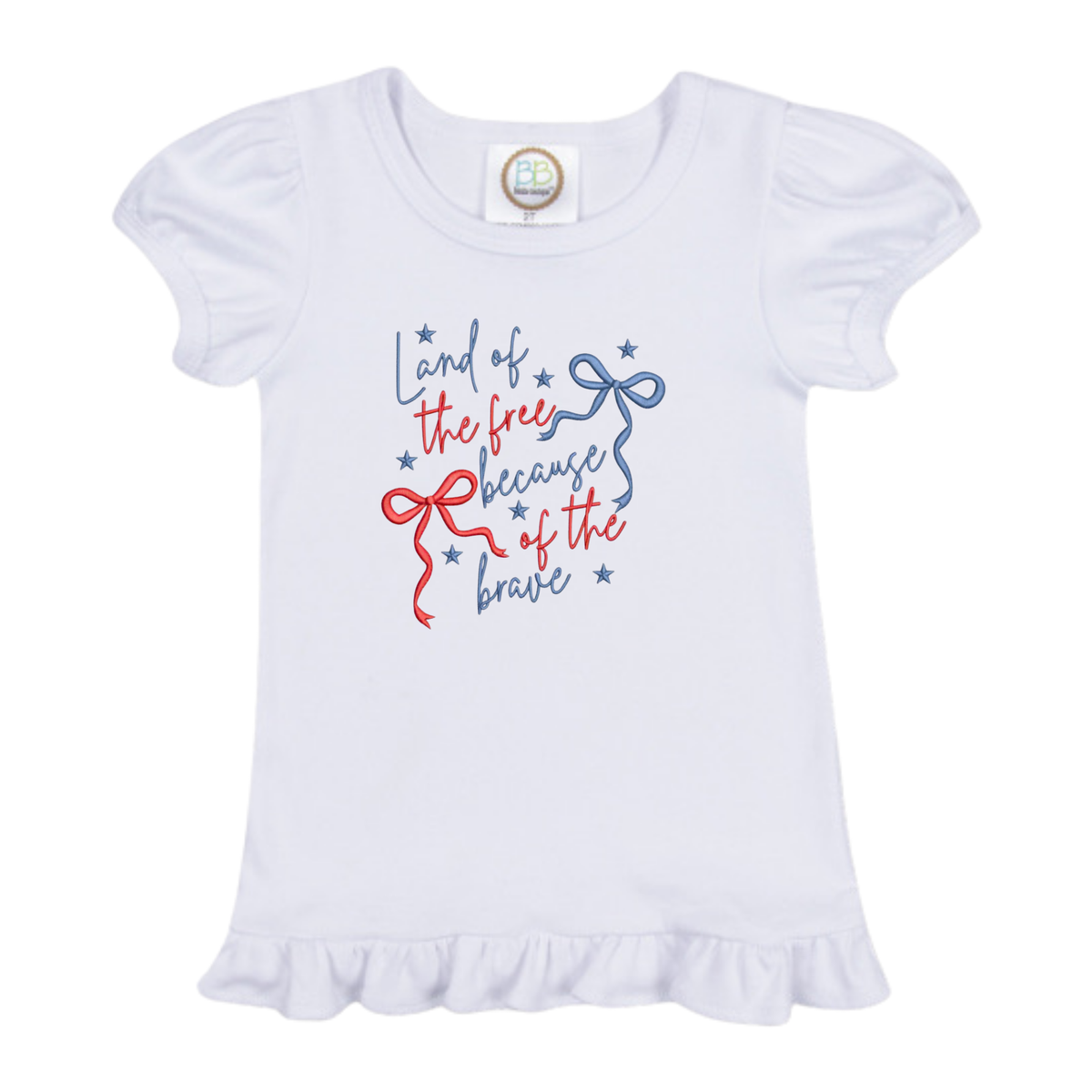 White toddler shirt with Land of the Free design featuring red and blue text with bows and stars