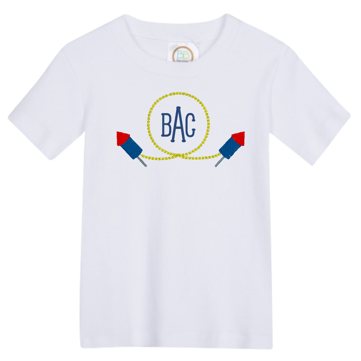White t-shirt with Firework Monogram Design featuring blue letters BAC inside a yellow circle with two firework rockets