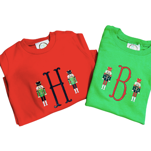 Red and green shirts with decorative lettering on a white background