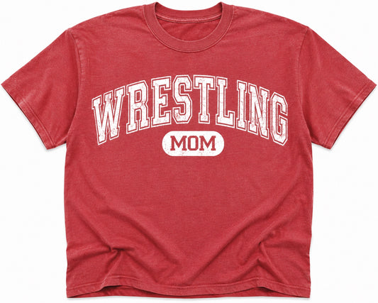 Red t-shirt with white distressed text reading Wrestling Mom in a vintage collegiate style