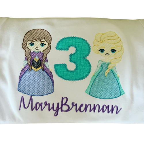 Embroidered shirt with two snow sisters and the number 3 on a white background
